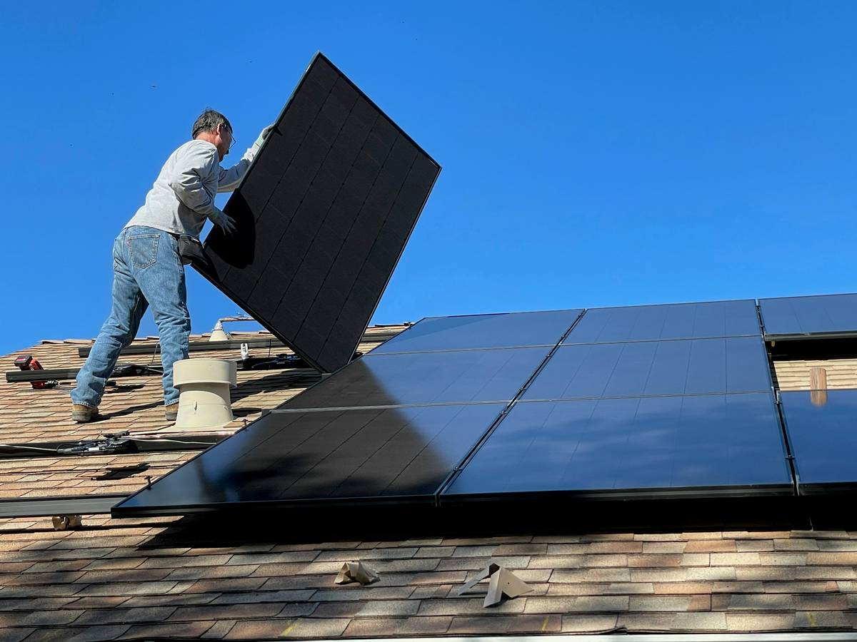 solar energy panel installation showing proper DC wiring with labeled MC4 connectors and conduit routing