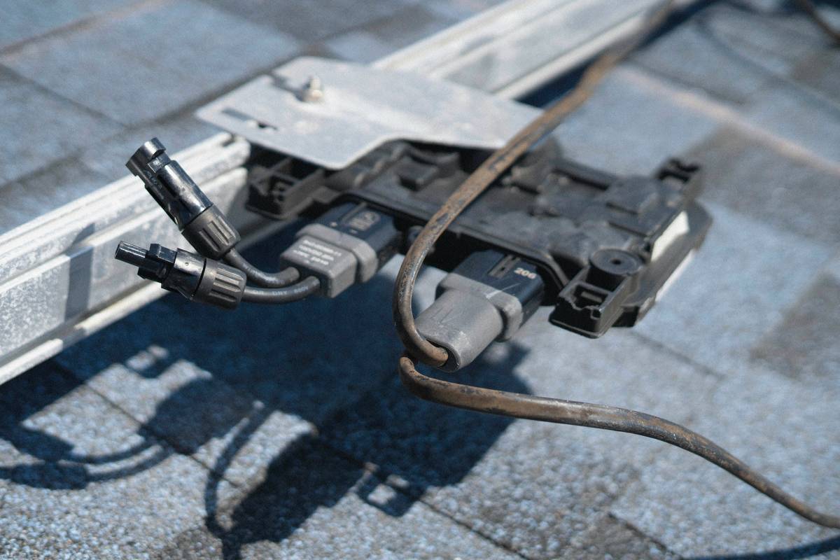 renewable energy panel wiring solar system showing series and parallel connections with labeled MC4 connectors and grounding clamp
